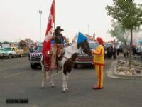 Miss Rodeo Canada riding Keotas Fast Cash talking with Ronald McDonald at the Whoop-Up Days Parade